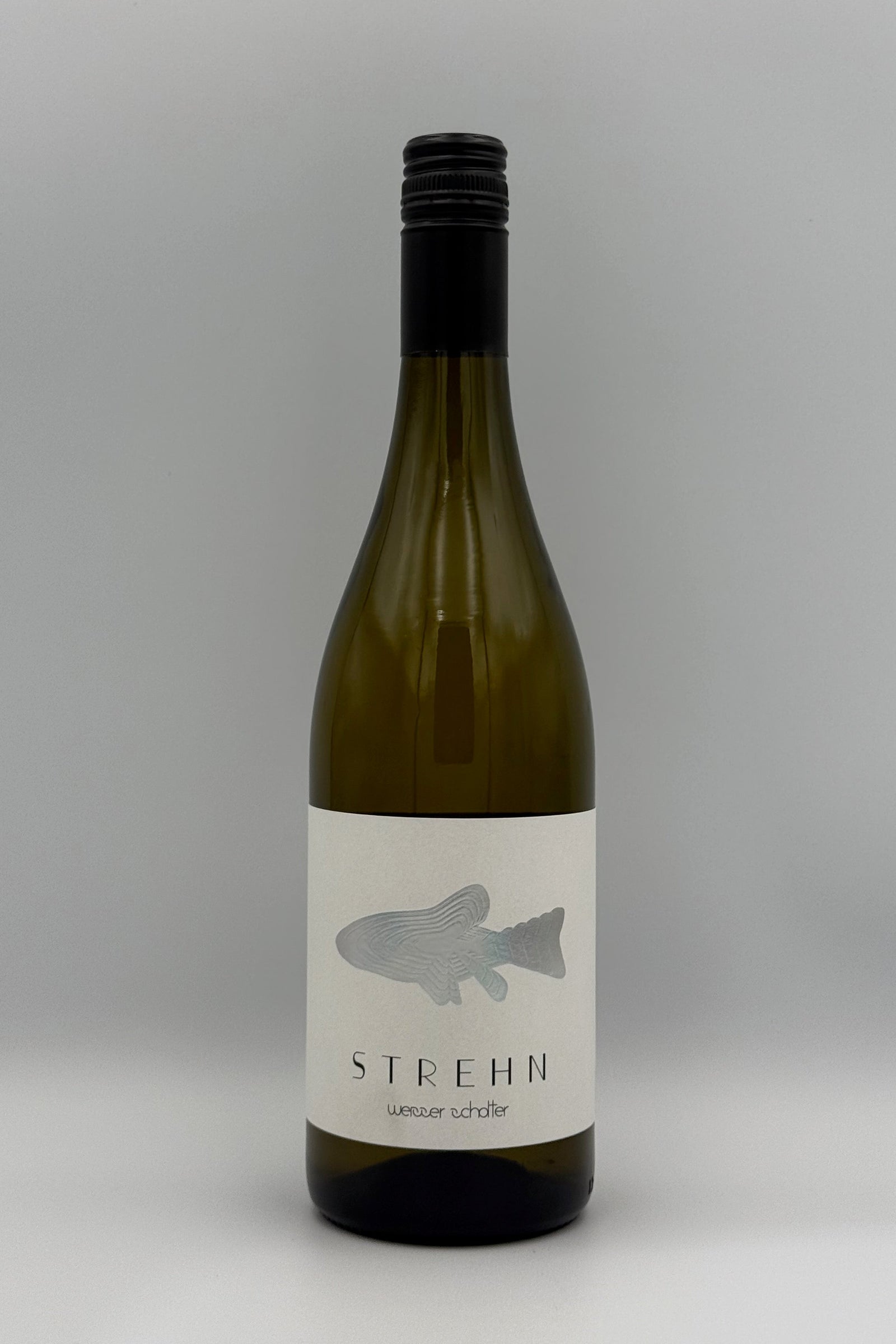 A bottle of Strehn Sauvignon Blanc wine with an off-white label featuring a gray fish silhouette, set against a neutral gray background.